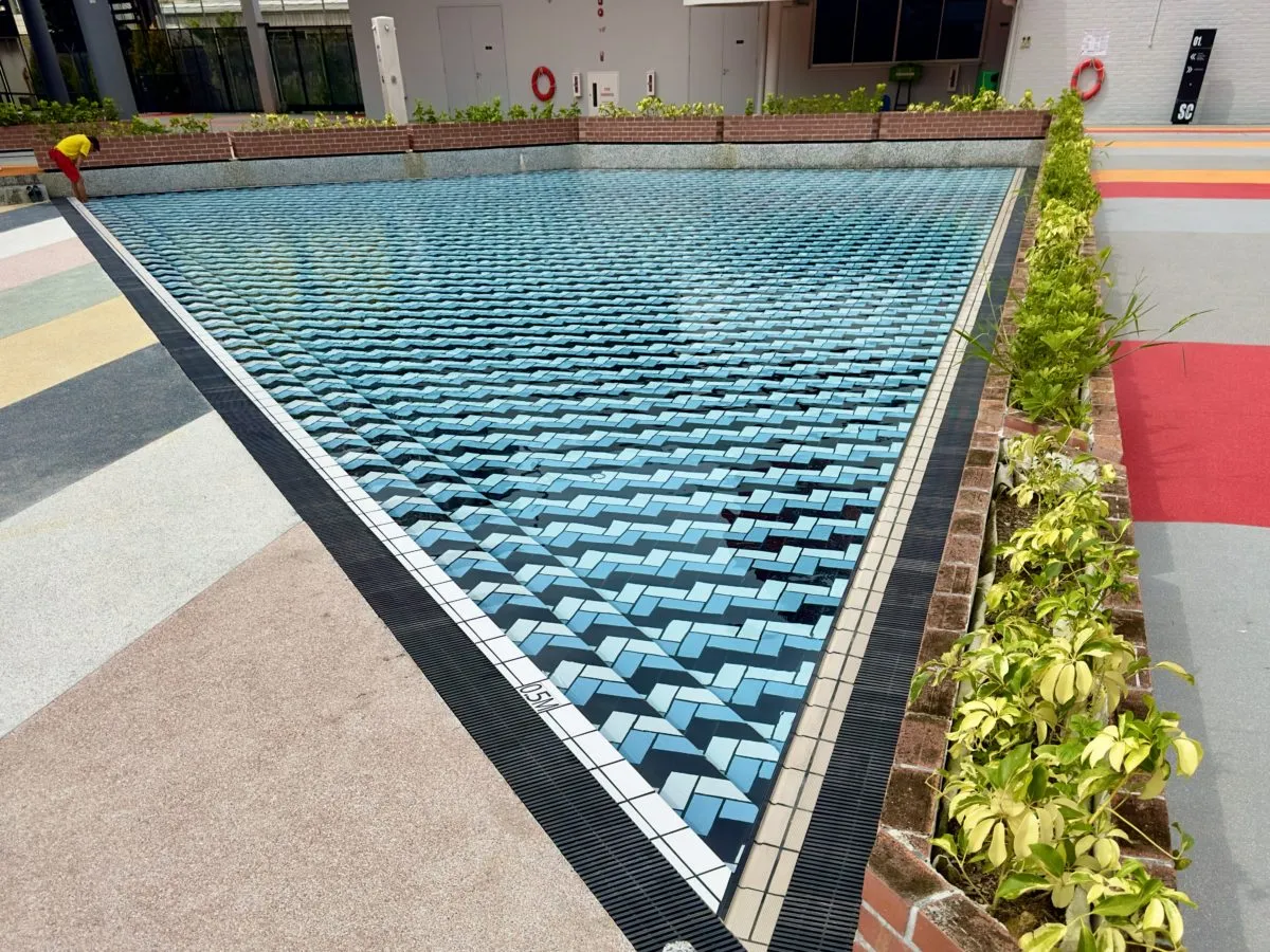 Wading pool with blue chevron tile pattern at Delta Swimming Complex